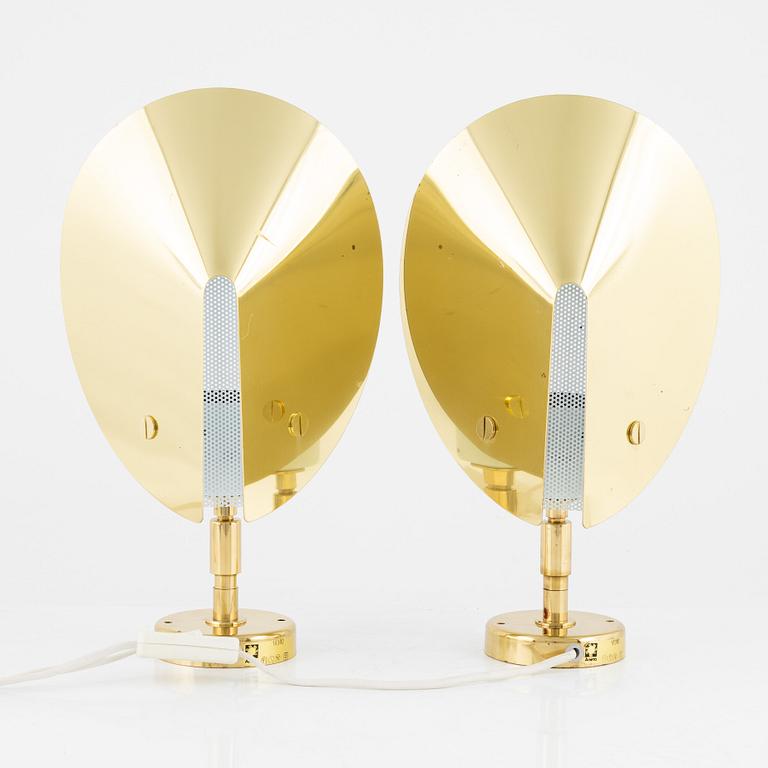 A pair of model 10302 brass wall lights, Aneta, Växjö.