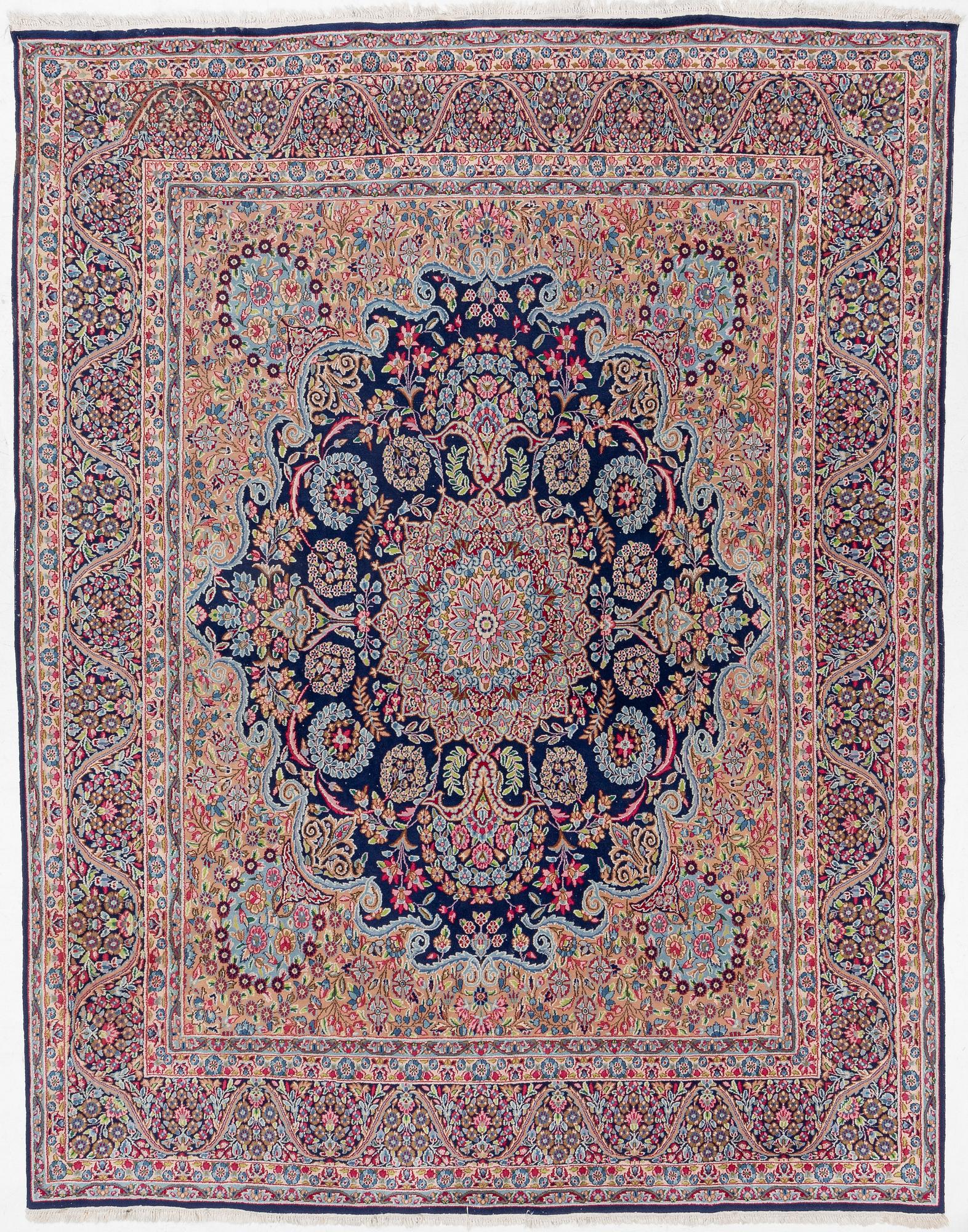 An oriental carpet, c. 385 x 300 cm.
