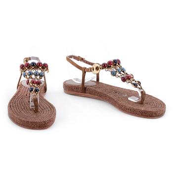 714. GUCCI, a pair of brown sandals.