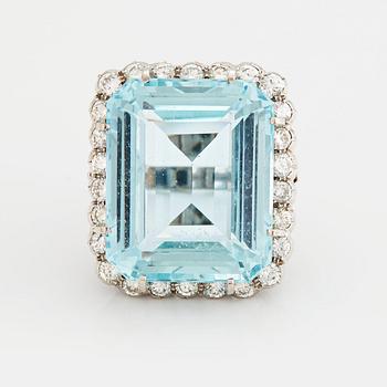 885. A RING set with an aquamarine and brilliant-cut diamonds.