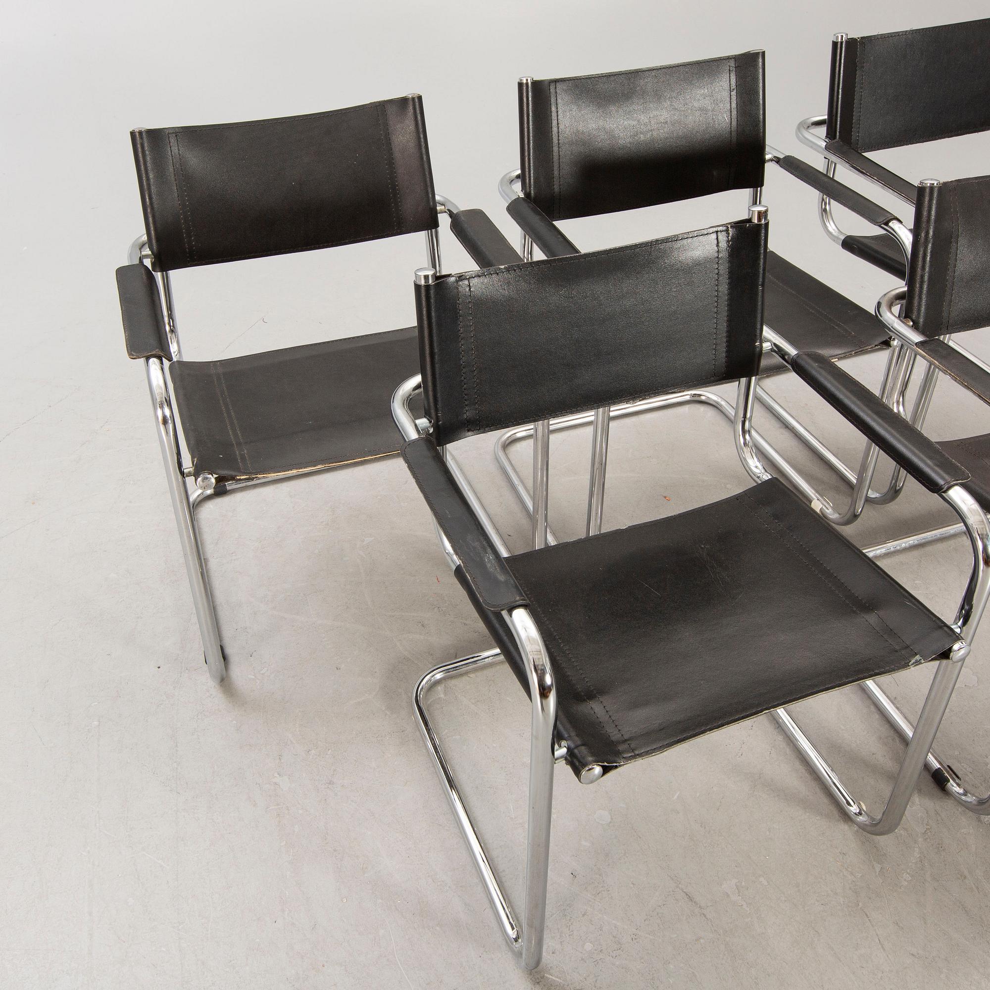 A set of five similar Italian 1970s chrome and leather armchairs.