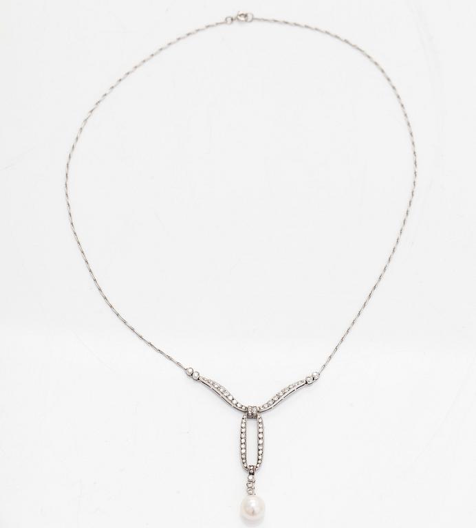 An 18K white gold necklace with brilliant-cut diamonds and a cultured pearl, England.