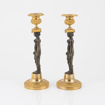 A pair of empire/style candlesticks.