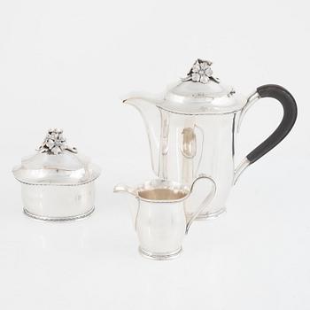 A Swedish Silver Coffee Pot, Creamer and Sugar Bowl, mark of Carl Fredrik Carlman, Stockholm 1951-54.