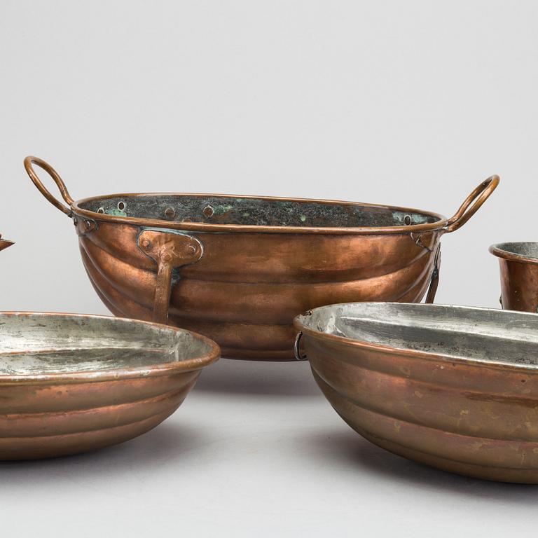 Six 19th century copper pots and pans.