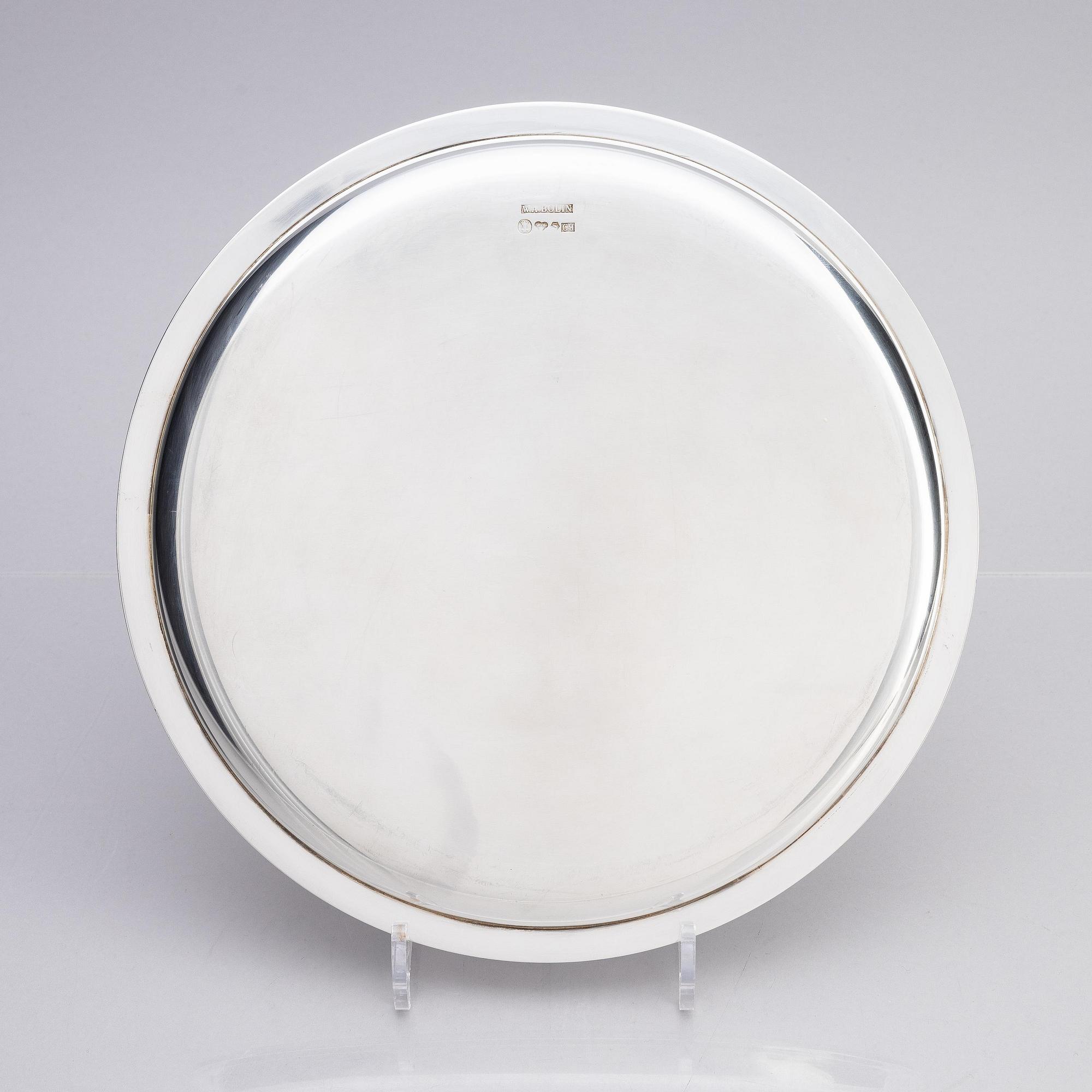 A Swedish silver dish and two silver coasters, marks of W.A. Bolin, Stockholm 1957.