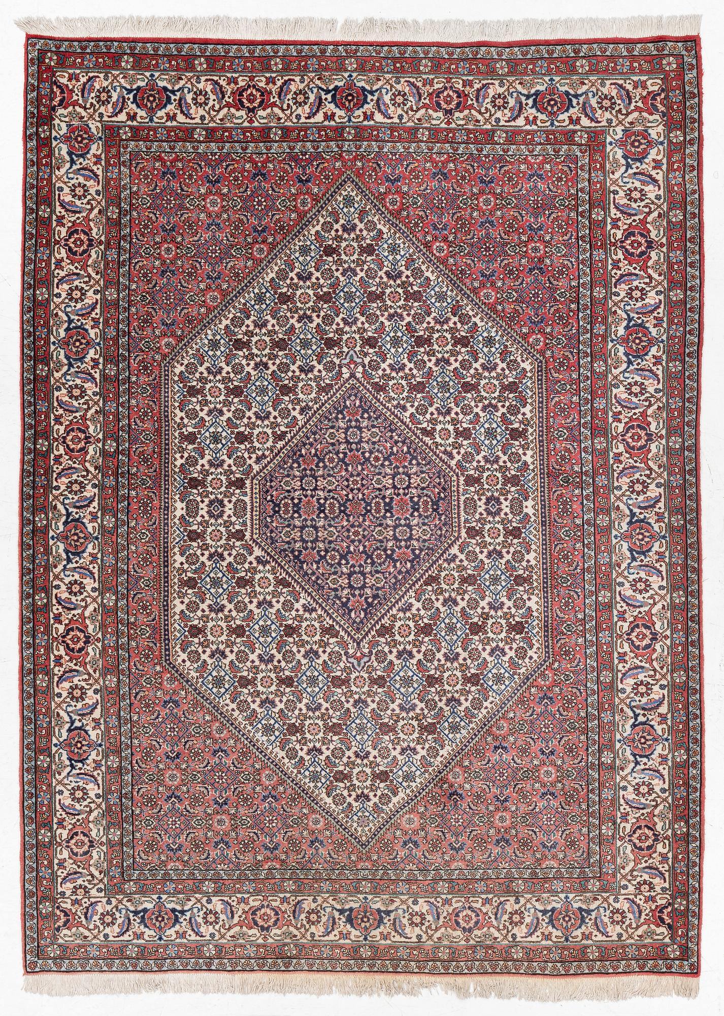 An oriental rug, approx. 238 x 174 cm.