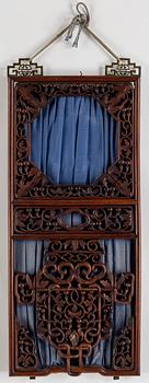 A Chinese carved hardwood panel/window, 20th century.