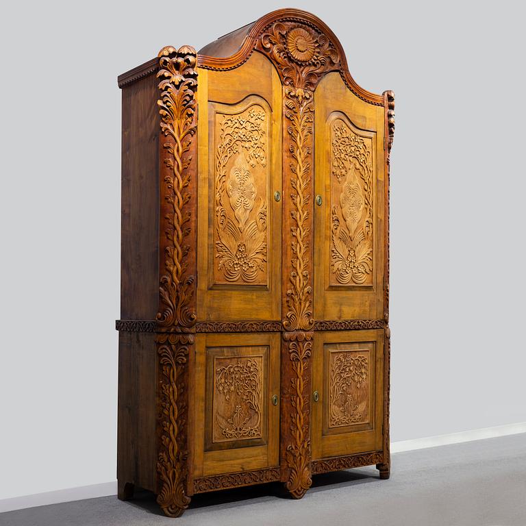 KNUT FJAESTAD, a folk art birch cabinet, early 20th century.