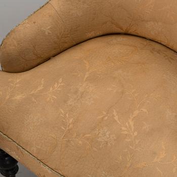 a pair of late 19th century easy chairs.