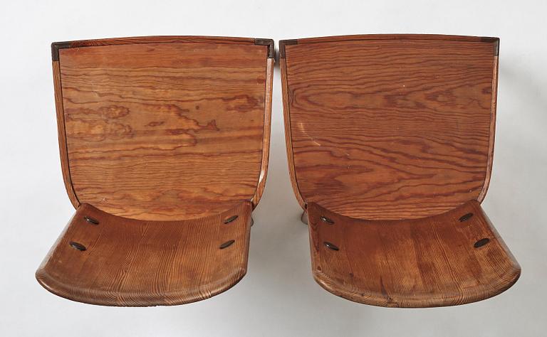 Axel Einar Hjorth, a pair of stained pine "Lovö" chairs, Nordiska Kompaniet, Sweden 1930's.