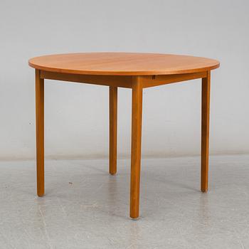 A second half of the 20th century teak veneered dining table.