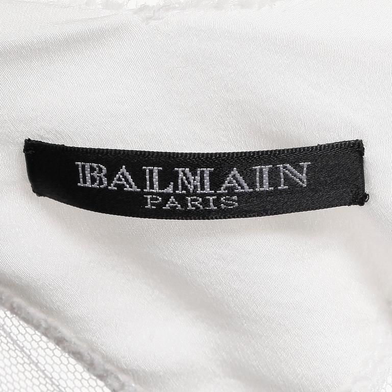 BALMAIN, a white silk dress.