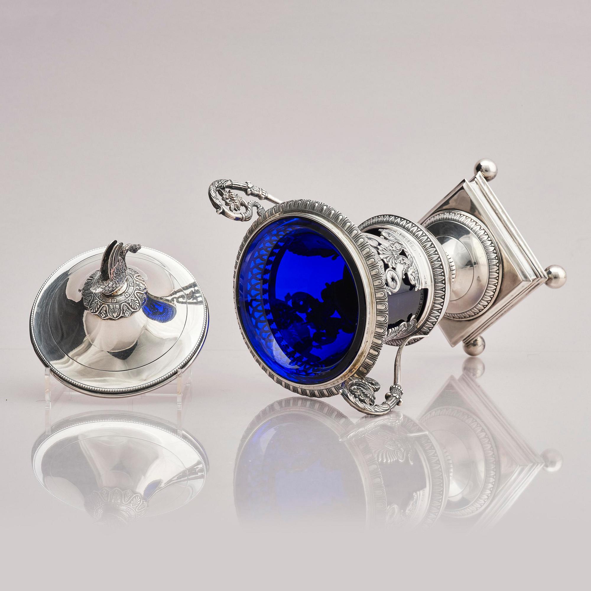 Lockurna, silver med blå glasinsats, Frankrike 1800-talets början.