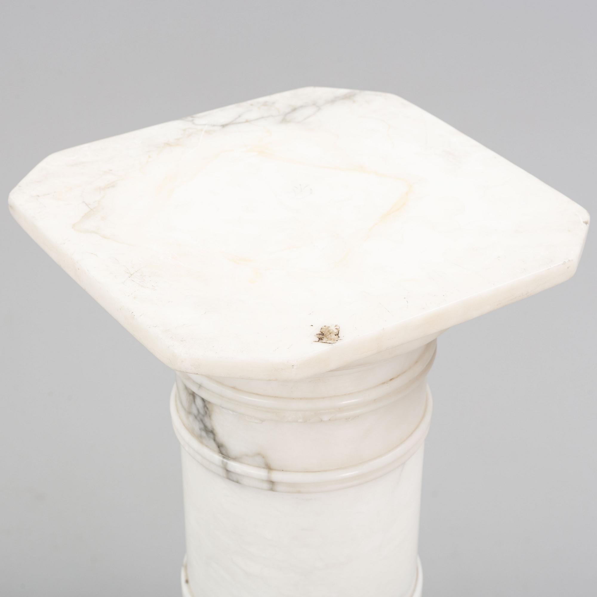 A marble pedestal, early 20th Century.