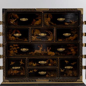 AN early 18TH CENTURY PROBABLY ENGLISH Japanned laquer cabinet on stand.