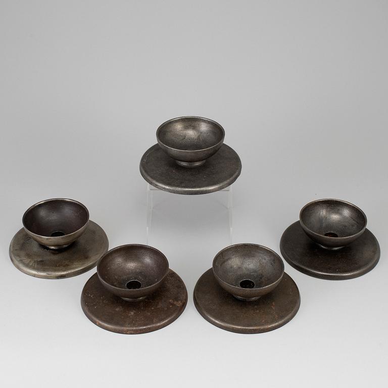 A set of 5 iron candlesticks by Skoglund & Olsson Gefle.