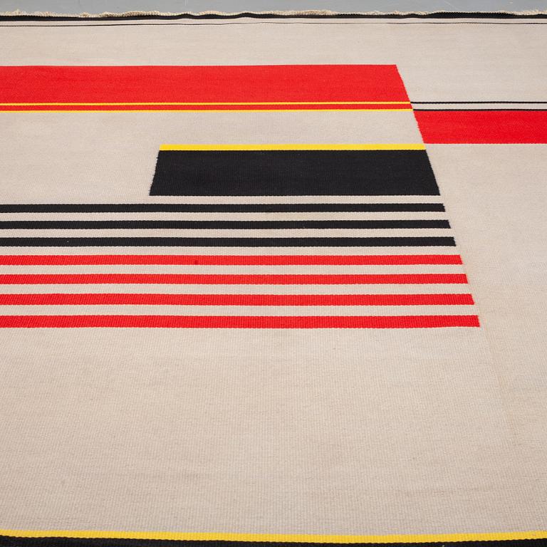 A CARPET, flat weave, attributed to Antonín Kybal, around 392 x 281 cm.