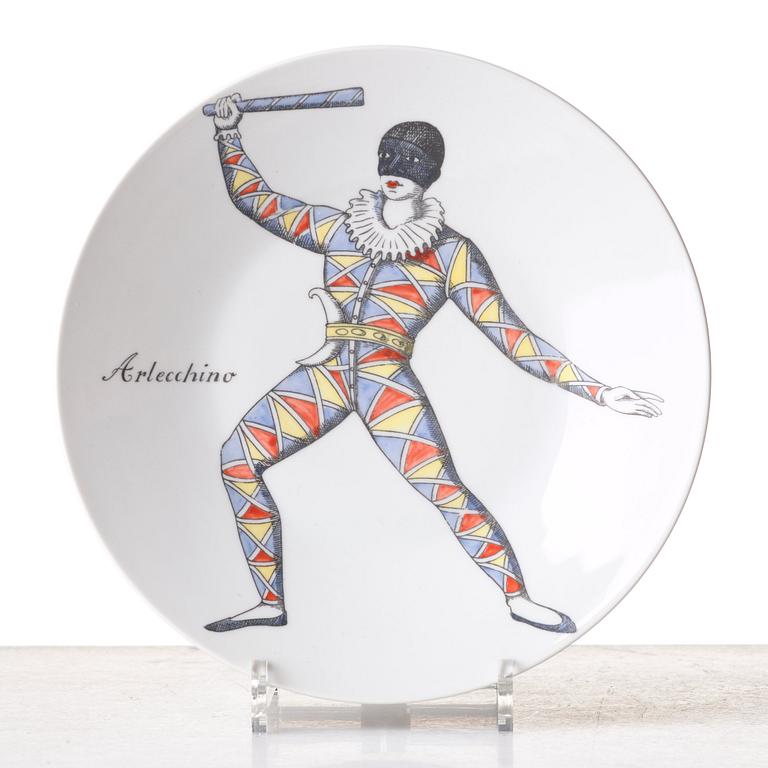 Piero Fornasetti, a set of 12 "Maschere Italiane" porcelain plates, Milan, Italy.