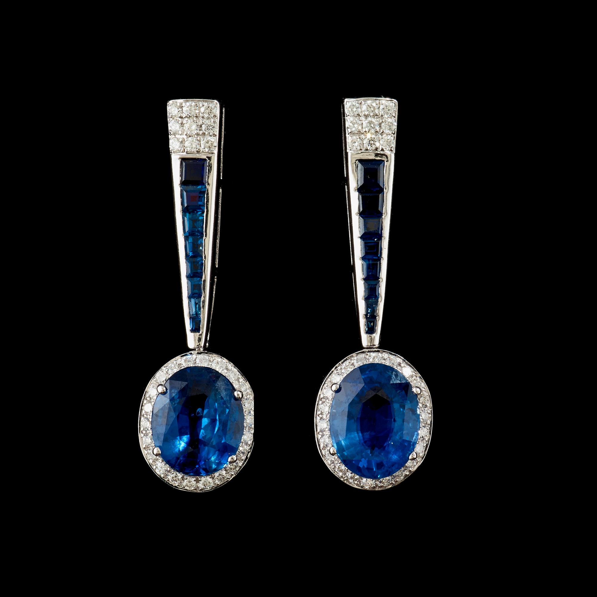 A pair of sapphire and diamond earrings. Sapphire total carat weight 5.63 cts, diamond total carat weight 0.62 ct.