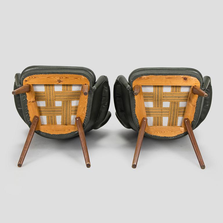 A pair of mid-20th century armchairs.