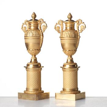 A pair of French Empire candlesticks, early 19th century.