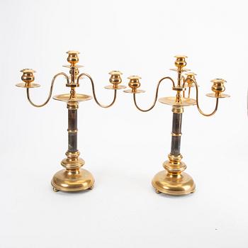 A pair of brass and wood candelabras early 1900s.