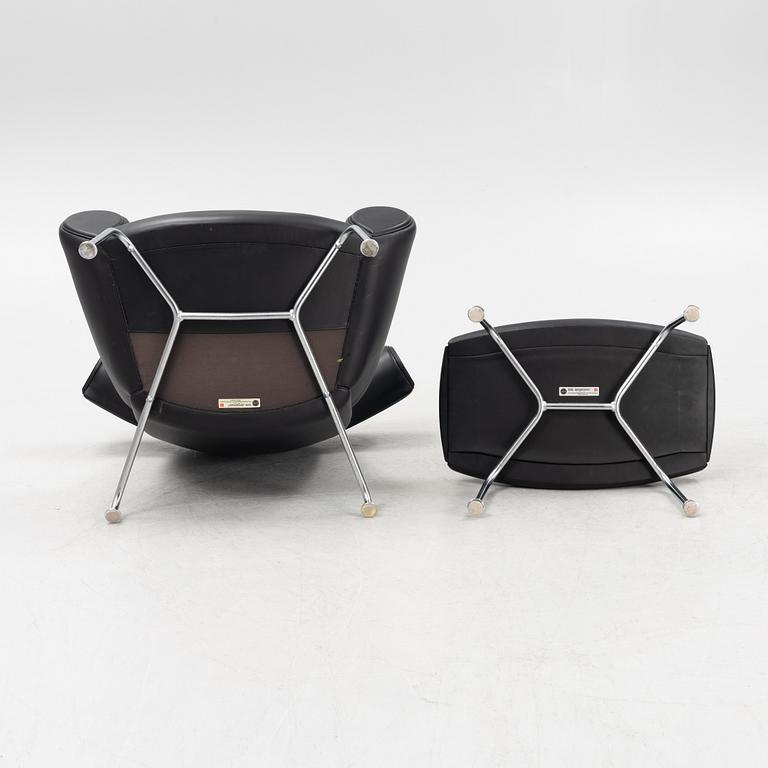 Hans J Wegner, an 'Ox Chair' and an ottoman, for Erik Jørgensen, Denmark, 2005 and 2010.