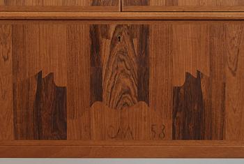 A Carl Malmsten mahogany cabinet with inlays of different types of wood, signed and dated 1958.