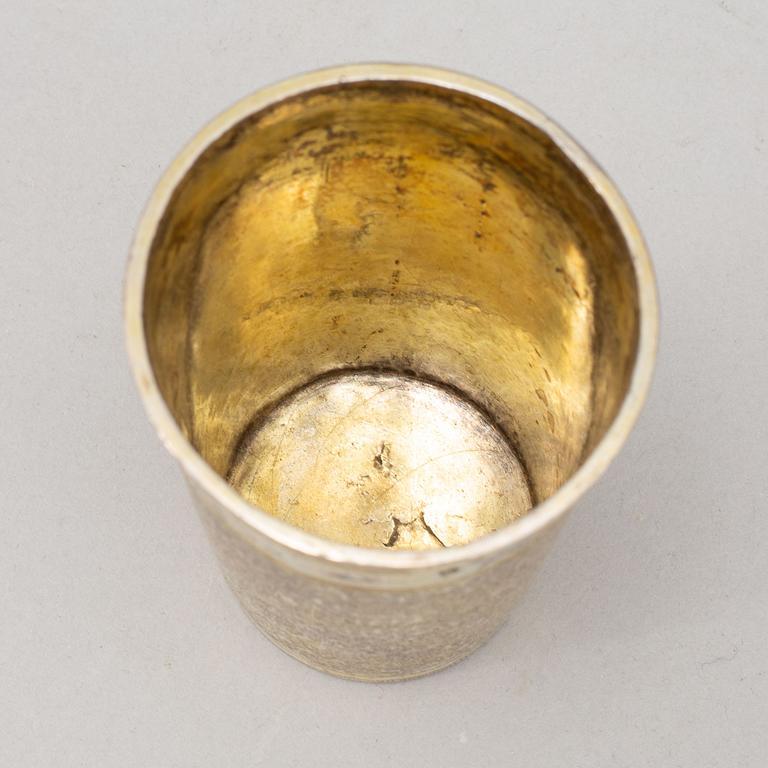 A German 17th century parcel-gilt silver beaker, unmarked. With later owners mark.