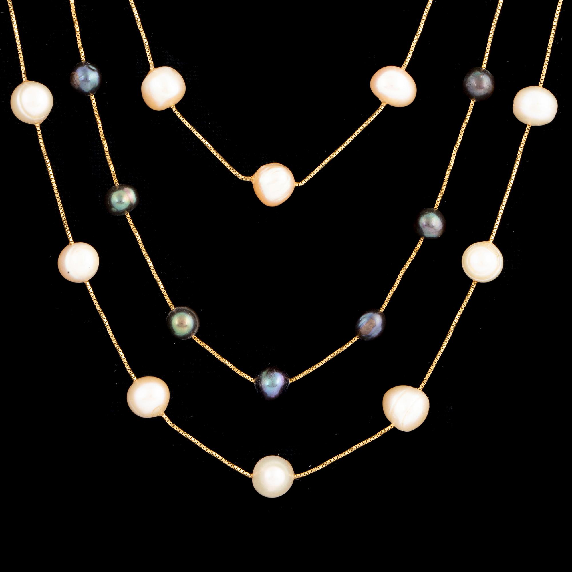 Two cultured pearl necklaces and cultured pearl bracelet.