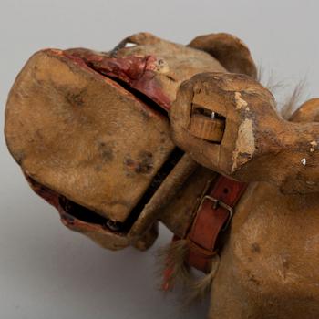 A circa 1900 papier maché toy dog.