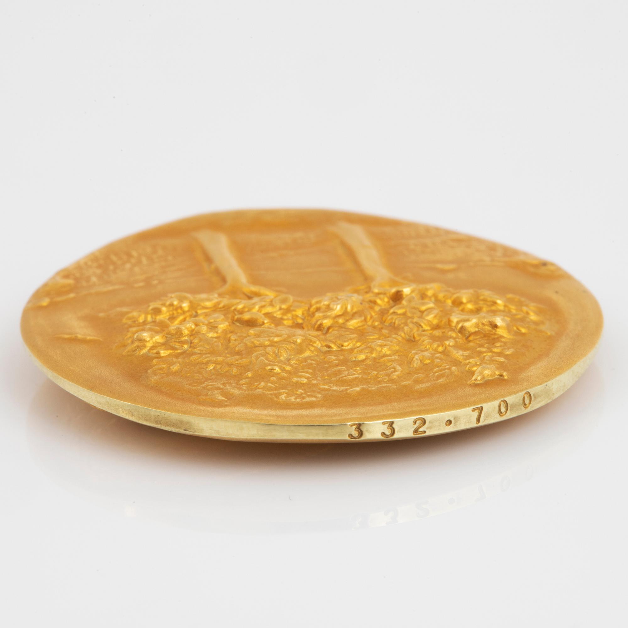 A Swedish commemorative medal in 18K gold.