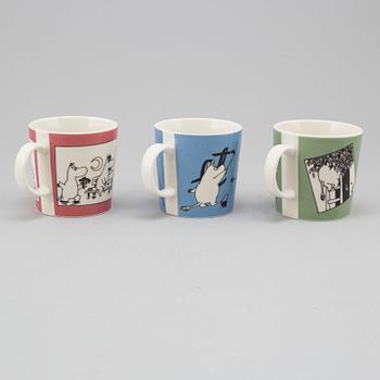 Three porcelain mugs by Arabia, Finland, with Moomin characters, 1990.