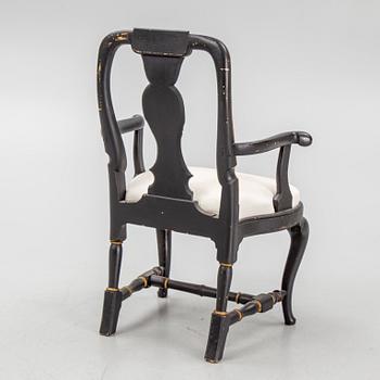 A rococo style armchair, around 1900.