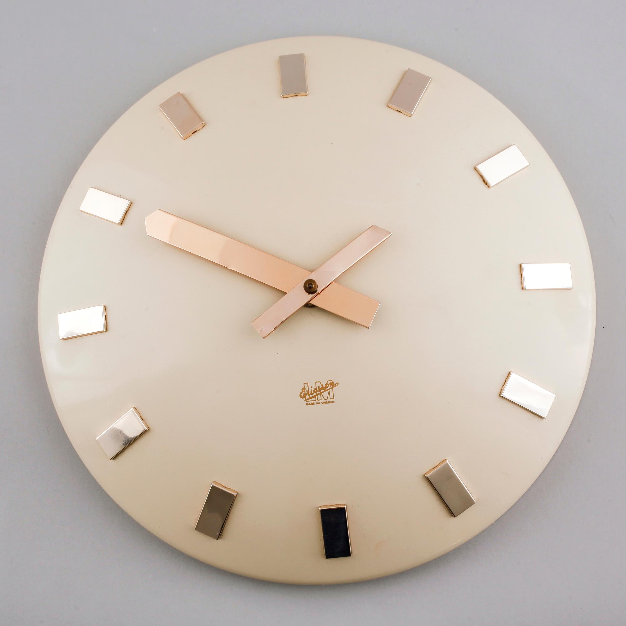 A 20th century wall clock by LM Ericsson.