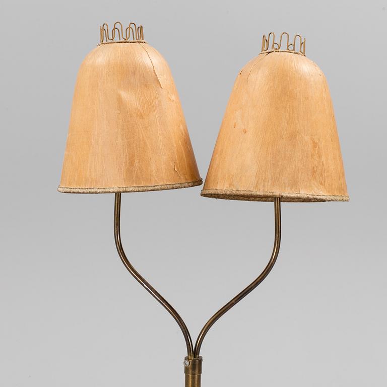 A brass floor lamp, mid 20 th century.