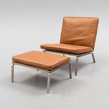 A 21st century easy chair and foot stool by Norr 11, Denmark.