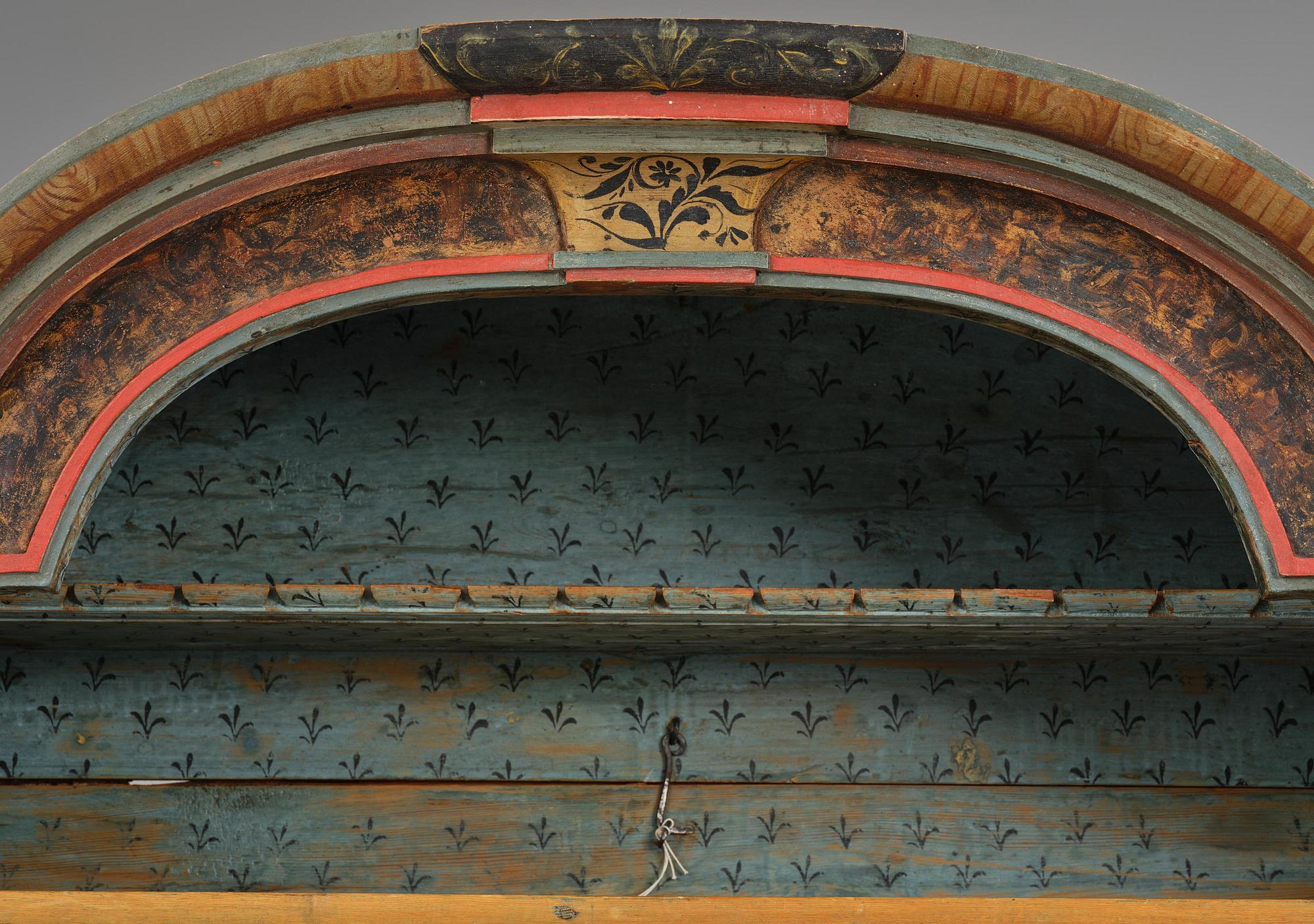 A polychrome-painted folk art cabinet from Värmland, Sweden, dated 1818.