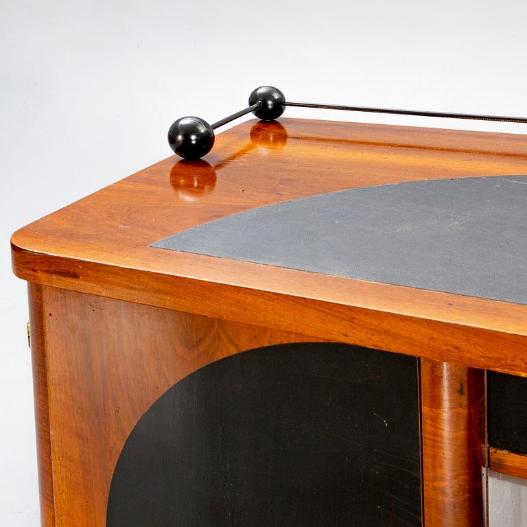 An Art Deco walnut desk.