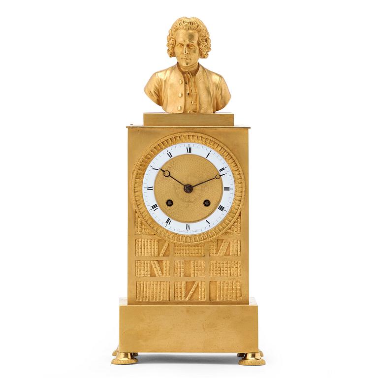 A late Empire first half 19th century gilt bronze mantel clock.