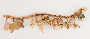 An 18K gold charm bracelet.