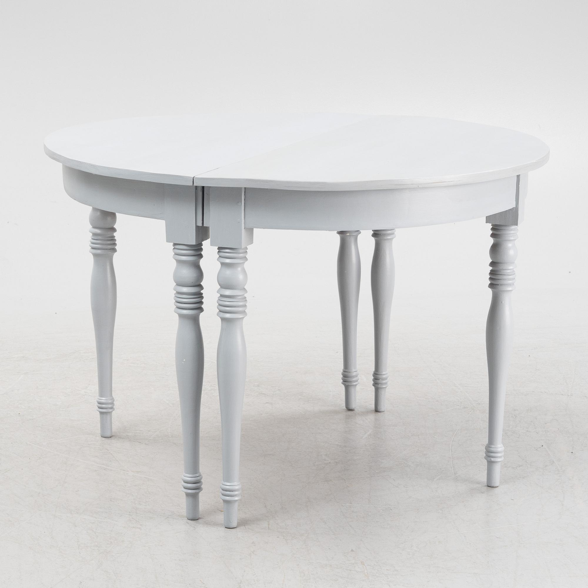 A late 19th century painted dining table.