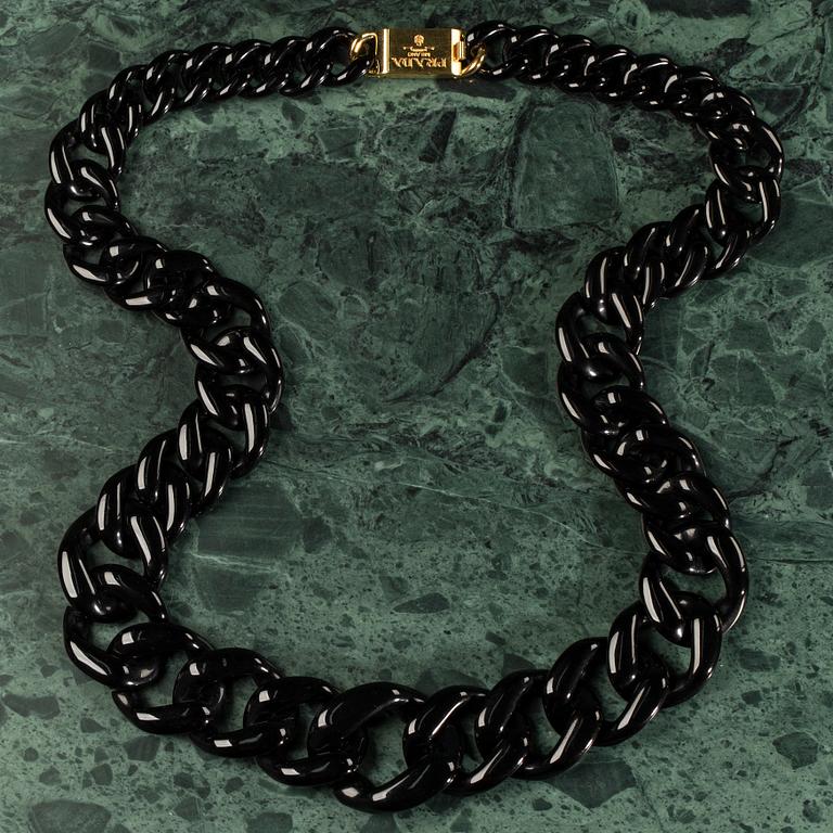 A necklace by PRADA.