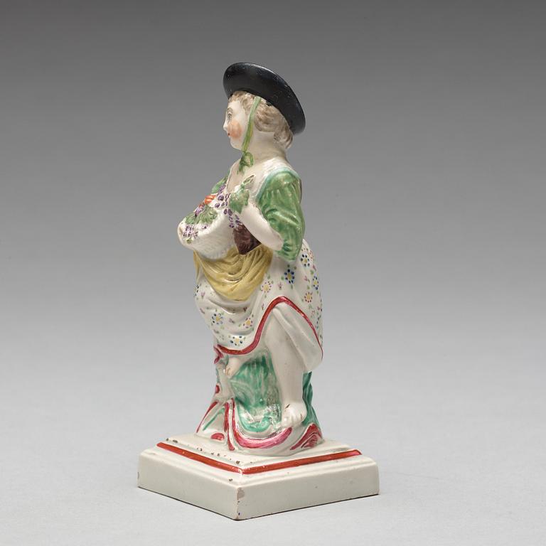 An English creamware figure representing Autumn, circa 1800.