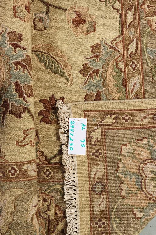 An oriental carpet with Mamluk design, c. 294 x 250 cm.