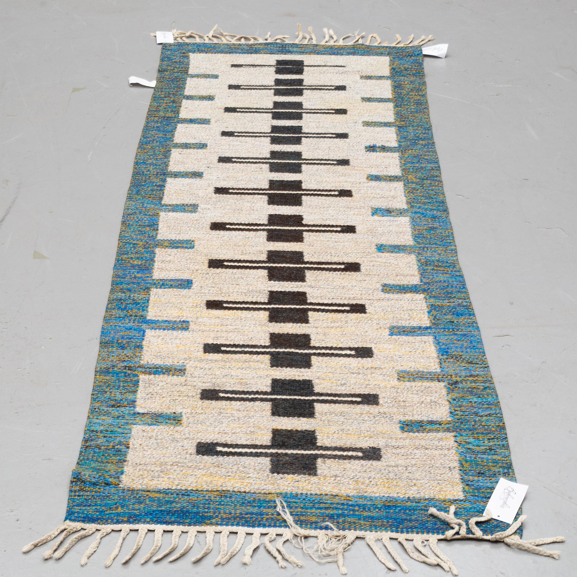 A runner, flat weave, ca 236 x 75 cm.