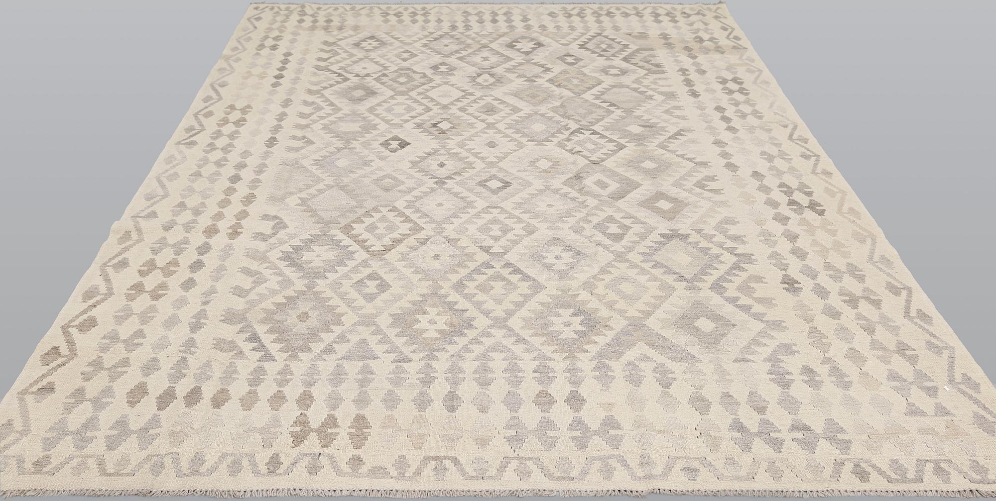 A kilim carpet, c 293 x 203.