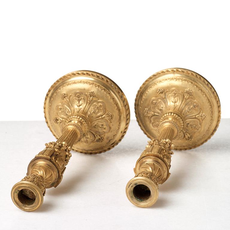 A pair of Louis XVI-style 19th century candlesticks by Raingo Frères, Paris.