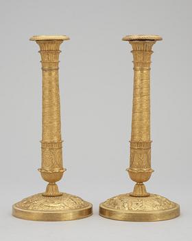 A pair of French Empire early 19th Century candlesticks.